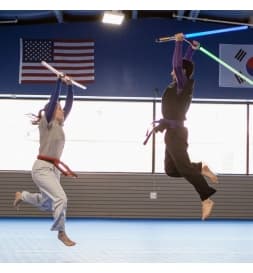 Ninjai Warrior students practicing with training sabers